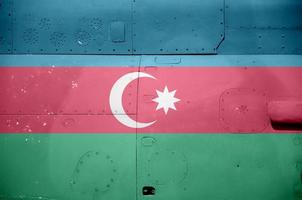 Azerbaijan flag depicted on side part of military armored helicopter closeup. Army forces aircraft conceptual background photo