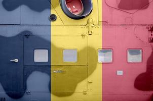 Chad flag depicted on side part of military armored helicopter closeup. Army forces aircraft conceptual background photo