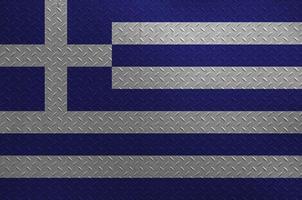 Greece flag depicted in paint colors on old brushed metal plate or wall closeup. Textured banner on rough background photo