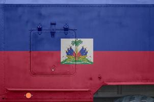 Haiti flag depicted on side part of military armored truck closeup. Army forces conceptual background photo