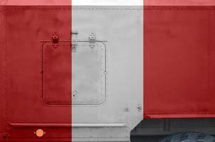 Peru flag depicted on side part of military armored truck closeup. Army forces conceptual background photo