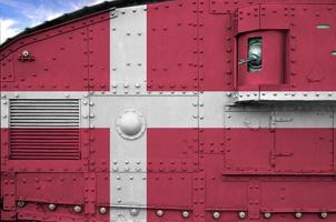 Denmark flag depicted on side part of military armored tank closeup. Army forces conceptual background photo