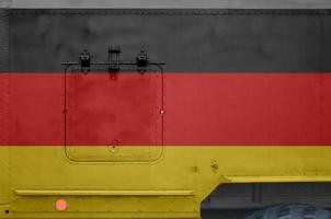 Germany flag depicted on side part of military armored truck closeup. Army forces conceptual background photo