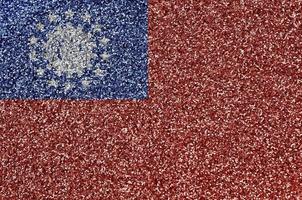 Myanmar flag depicted on many small shiny sequins. Colorful festival background for party photo
