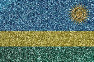 Rwanda flag depicted on many small shiny sequins. Colorful festival background for party photo