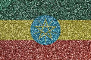 Ethiopia flag depicted on many small shiny sequins. Colorful festival background for party photo