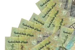 20 Egyptian pounds bills lies in different order isolated on white. Local banking or money making concept photo