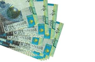 500 Kazakhstani tenge bills lies in small bunch or pack isolated on white. Mockup with copy space. Business and currency exchange photo