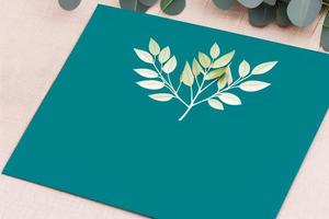 Mockup for a letter or wedding invitation with branches and leaves. Natural light and shade coverage. photo