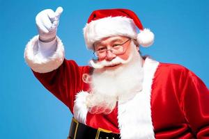 Cheerful Santa Claus is placing gift boxes. Merry Christmas and happy holidays. photo