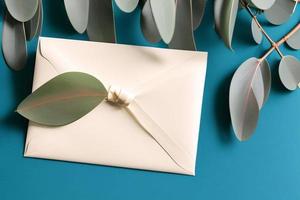 Mockup for a letter or wedding invitation with branches and leaves. Natural light and shade coverage. photo