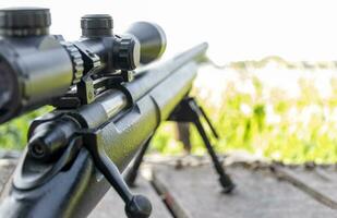 Rifle with a scope and bipod photo