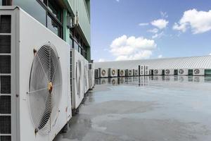 Close up air compressor on rooftop photo