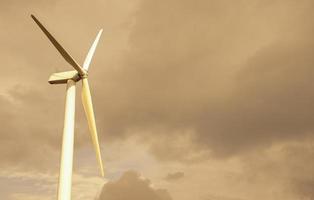 Wind turbines on yellow sky photo