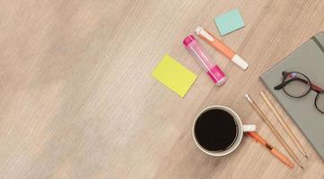 Top view coffee ,pen and notebook on table with copy space photo