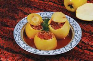 Stuffed Quince - The stuffing prepared with onion, minced meat, rice, parsley, olive oil, salt, black pepper and cumin is put into the quinces. photo