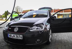 Bremerhaven Bremen Germany 2011 Black noble VW Volkswagen Golf GTI sports car in Germany. photo