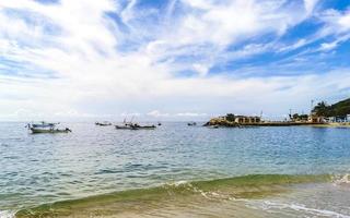 Puerto Escondido Oaxaca Mexico 2022 Fishing boats at the harbor beach in Puerto Escondido Mexico. photo