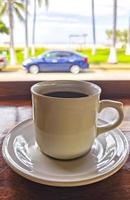 Cup of americano black coffee in restaurant Mexico. photo