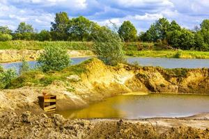 Quarry pond Nesse used as construction site and beach Germany. photo
