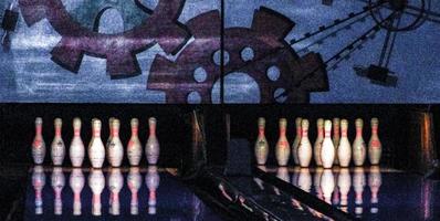 Teenagers and children play bowling throw bowling ball in Germany. photo