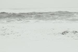 Large wave with heavy foam monochrome landscape photo