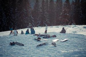 Snowboarders team at resort landscape photo