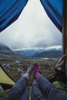 Close up tourists resting in tent at highland concept photo