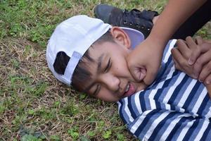 Soft focus of Southeast Asian boys are quarreling and fighting, fights between friends, misunderstandings and mutual forgiveness among friends concept. photo