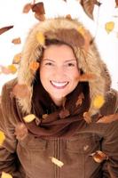 Woman with autumn leaves photo