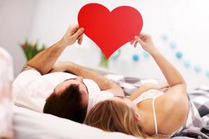 Adult attractive couple in bed photo
