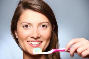 Girl Brushing teeth photo