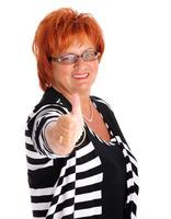 Mature businesswoman on white background photo