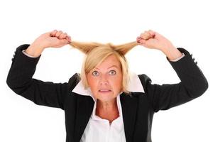 Frustrated businesswoman on white background photo