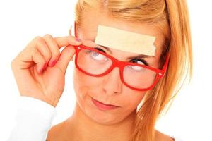 Woman with tape on forehead photo