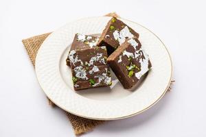 chocolate barfi or choco burfi cake, a tweak to indian dessert or sweet for festivals photo