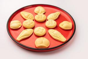 Sandesh or shondesh is a dessert, originating from the Bengal, India, created with milk and sugar photo