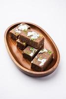 chocolate barfi or choco burfi cake, a tweak to indian dessert or sweet for festivals photo