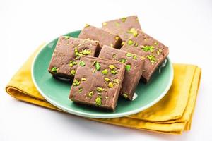 chocolate barfi or choco burfi cake, a tweak to indian dessert or sweet for festivals photo