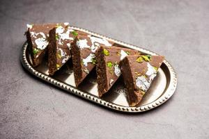 chocolate barfi or choco burfi cake, a tweak to indian dessert or sweet for festivals photo