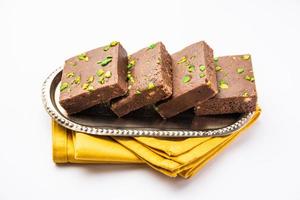 chocolate barfi or choco burfi cake, a tweak to indian dessert or sweet for festivals photo