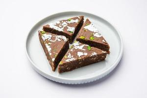 chocolate barfi or choco burfi cake, a tweak to indian dessert or sweet for festivals photo