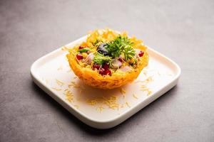 Aloo Tokri Chaat or Potato Basket stuffed chat or katori chat photo