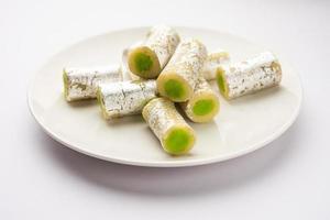 Kaju Pista Roll Or Cashew Pistachio Rolls Mithai or sigar, Indian sweet or dessert for festivals photo