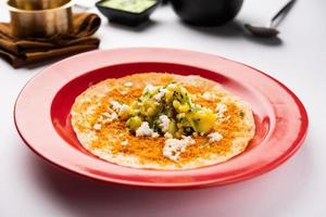 Mysore Masala Dosa or open dosa served with sambar and chutney, selective focus photo