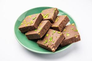 chocolate barfi or choco burfi cake, a tweak to indian dessert or sweet for festivals photo