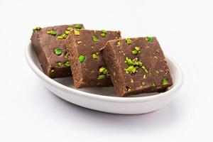 chocolate barfi or choco burfi cake, a tweak to indian dessert or sweet for festivals photo