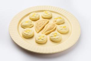 Sandesh or shondesh is a dessert, originating from the Bengal, India, created with milk and sugar photo