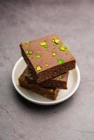 chocolate barfi or choco burfi cake, a tweak to indian dessert or sweet for festivals photo