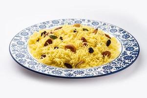 Kashmiri sweet modur pulao made of rice cooked with sugar, water flavored with Saffron and dry fruits photo